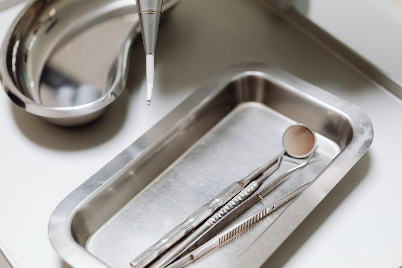 Sterilised dental instruments laid out on a steel tray